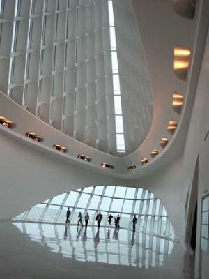 Windows onto lake, shaped like the prow of a white shi