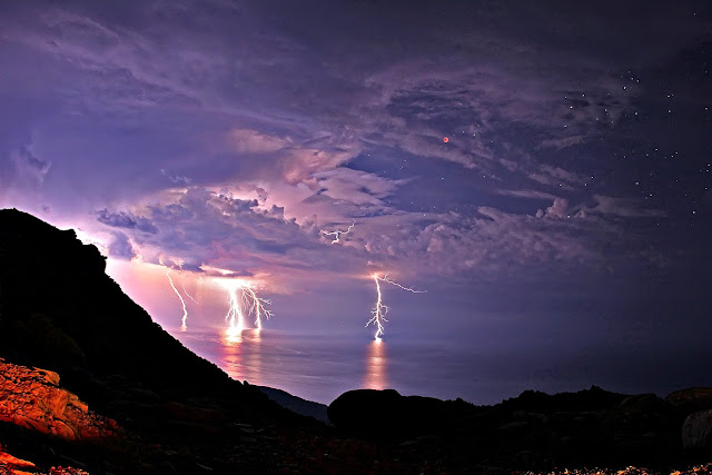 Total Lunar Eclipse and Lightning  Icaria, Greece June 15, 2011  Image Credit & Copyright: Chris Kotsiopoulos