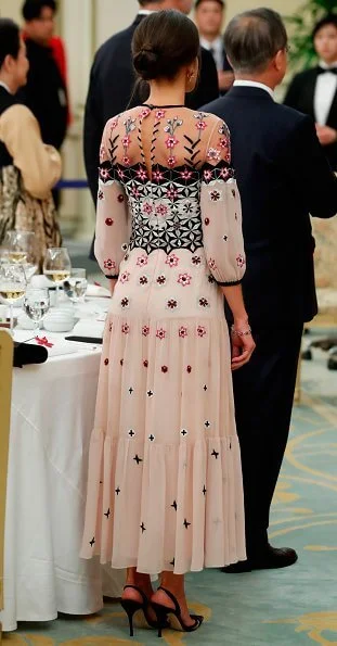 Queen Letizia wore Temperley London Eggshell floral embroidery tulle midi dress and Hugo Boss Dadoria beltedsheath dress