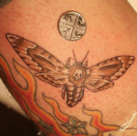miniature moth tattoo