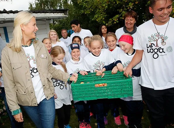 Crown Princess Mette-Marit of Norway visited a apple-picking project  'Lif Laga' at the Høybråten Sports Park in Oslo