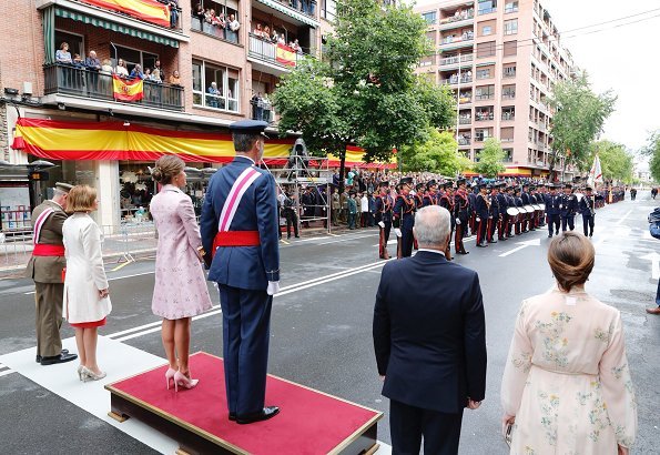 Queen Letizia wore Carolina Herrera Coat and Queen Letizia Jewels Coolook Sarin Earrings, she wore Magrit pups and carried clutch at Armed Forces Day