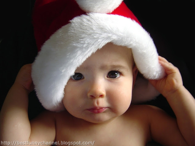 Baby dressed in Santa.