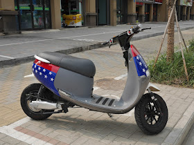 motor scooter with red, blue, and white stars