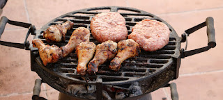 Meat cooking on the BBQ Meat cooking on the BBQ