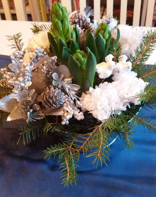 Flower arrangement with hyacinths and fake cloves