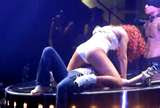 Rihanna on stage with girl from audience