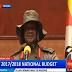 Ugandan President Museveni shows off the hat he designed. 