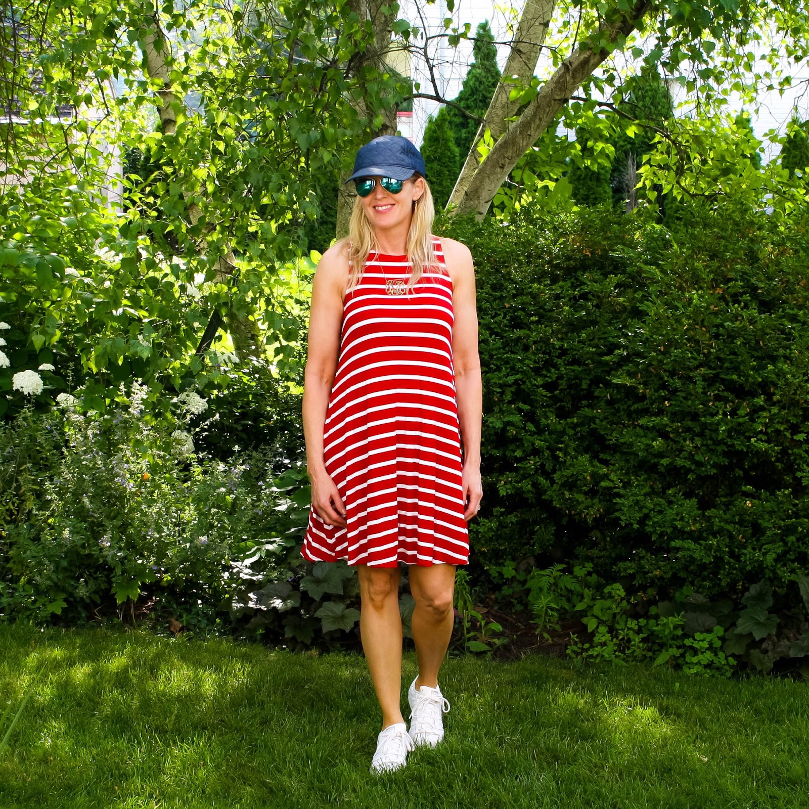 red striped dress, baseball hat and sneakers