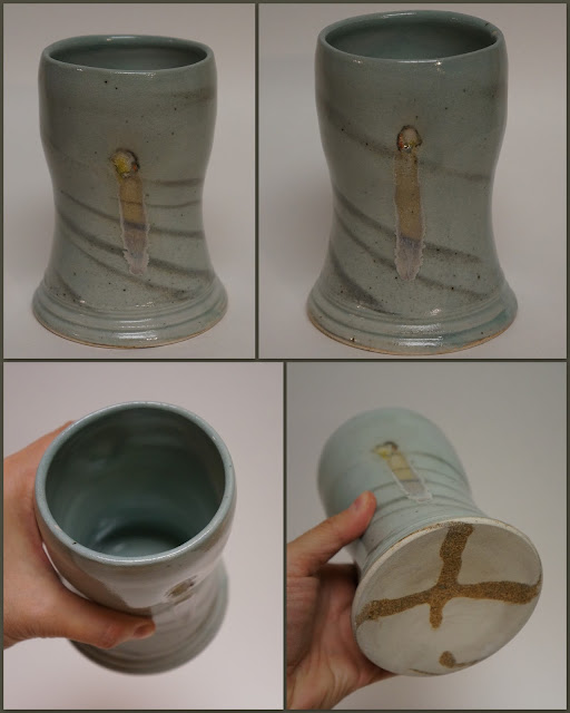 Ceramic pottery beer weisen mug cup with marbled design.