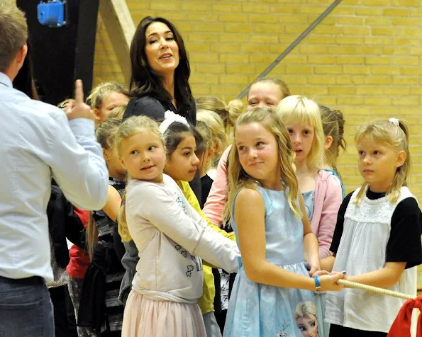 Crown Princess Mary wore Prada dress, Gianvito Rossi dress, coat, Gold diamond earrings, Prada trousers, new winter trend dress