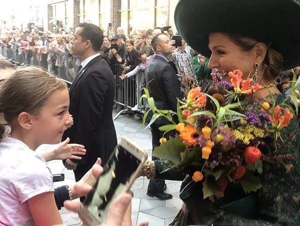 Dutch Queen Máxima attended Leidsche Rijn's 20th anniversary celebrations. Queen wore a green lace dress and pumps by Natan. diamond earrings