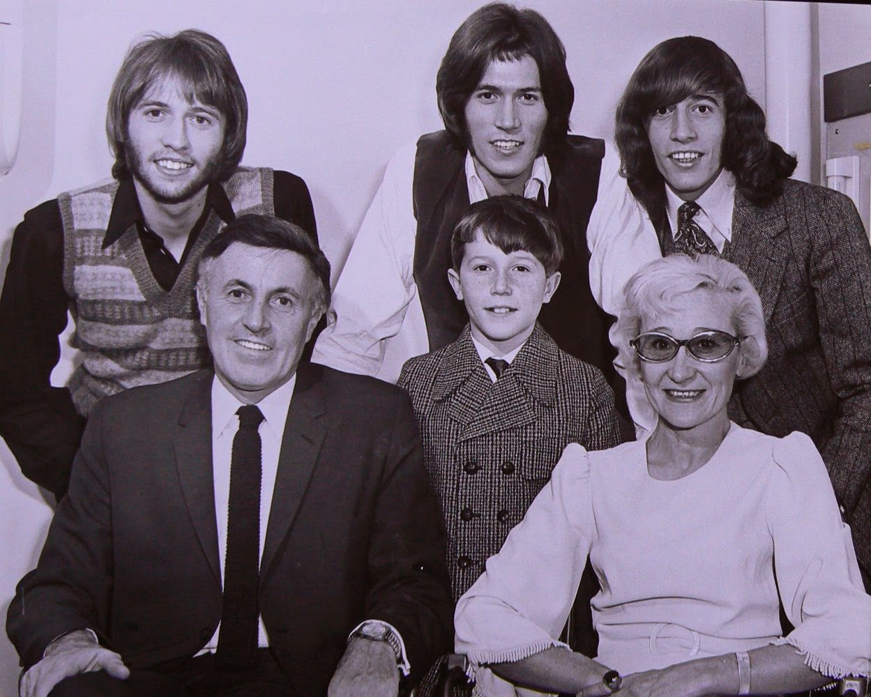 A photo of the Bee Gees (back row): Maurice, Barry and Robin Gibb, along with the rest of their family (front): Hugh, Andy and Barbara Gibb. 5 of 23Bee Gees: With age comes interesting hair. A photo of the Bee Gees (back row): Maurice, Barry and Robin Gibb, along with the rest of their family (front): Hugh, Andy and Barbara Gibb. http://www.jinglejanglejungle.net/2015/01/bgs.html