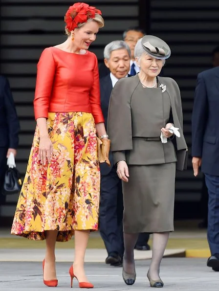 Belgian King Philippe and Queen Mathilde are welcomed by Japanese Emperor Akihito and Empress Michiko upon their arrival at the Imperial Palace. Mathilde Natan Dress