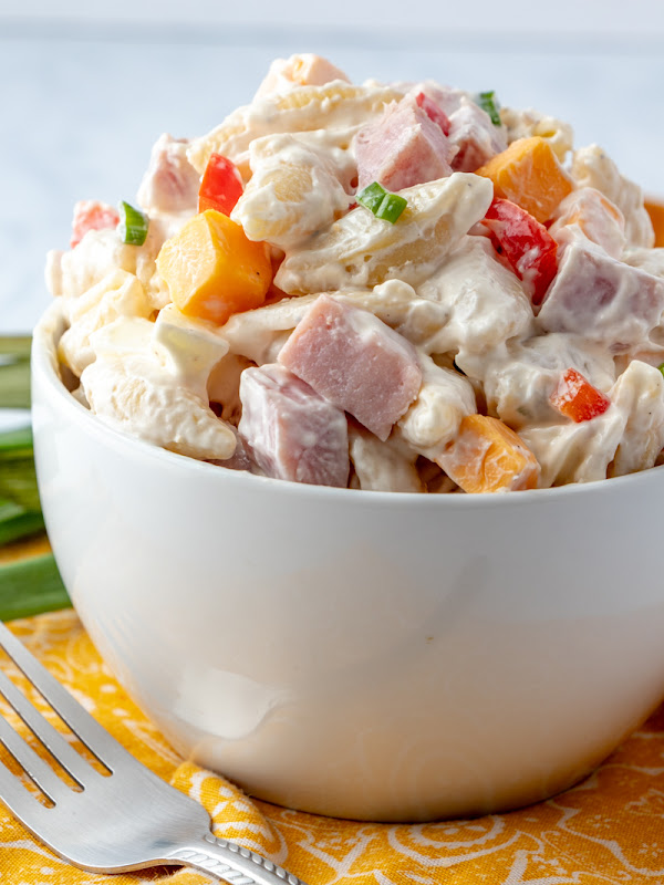 Perfect for any picnic, BBQ, potluck or event! This salad feeds a crowd and it's everyone's favorite! Great for using leftover Christmas or Easter Ham and hard boiled eggs!  Ham, Egg, Cheese and Veggie Pasta Salad Recipe