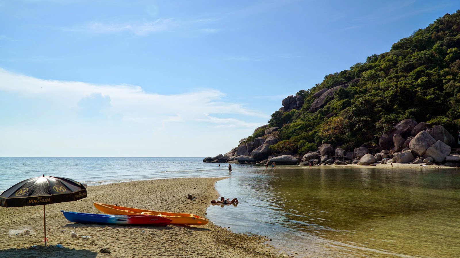 During high tide, the sandbar partially disappears into the water