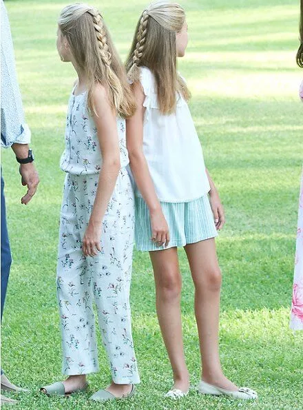 Princess Leonor wore Mango floral print top and trousers, Queen Letizia wore a pink floral print v-neck summer dress