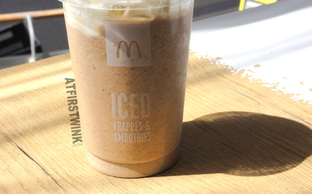 McDonalds iced frappé chocolate chip: ice coffee with crushed ice, whip cream, a mix of caramel and chocolate sauce, and little bits of chocolate (close-up)