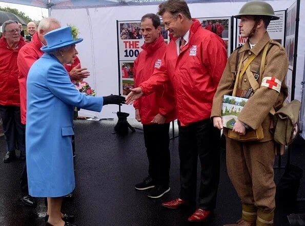 Queen Elizabeth opened the new housing development of Haig Housing. Pearl earring and pearl necklace, diamond brooch