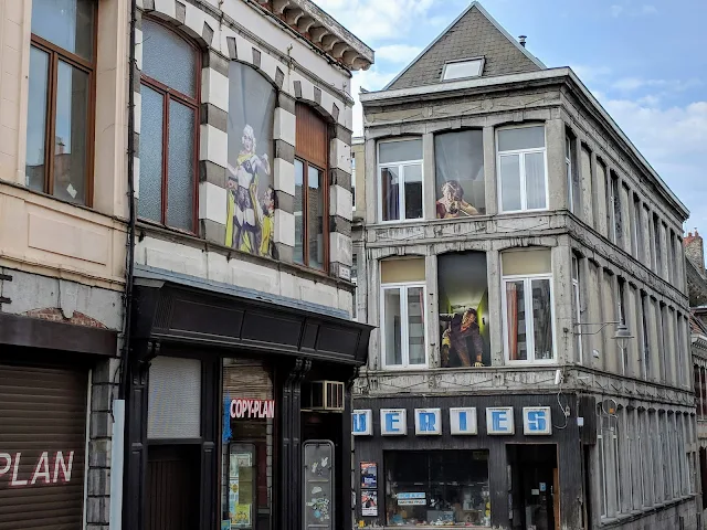 What to do in Mons Belgium: street art in building windows