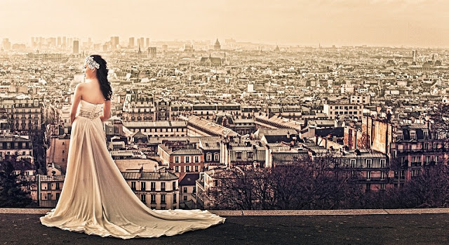 elegant bride posing with the paris city as the backdrop view of the city of paris