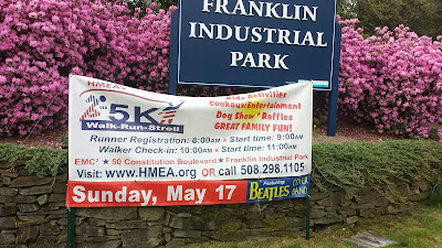 advertising the HMEA 5K at the Franklin Industrial Park entrance off King St