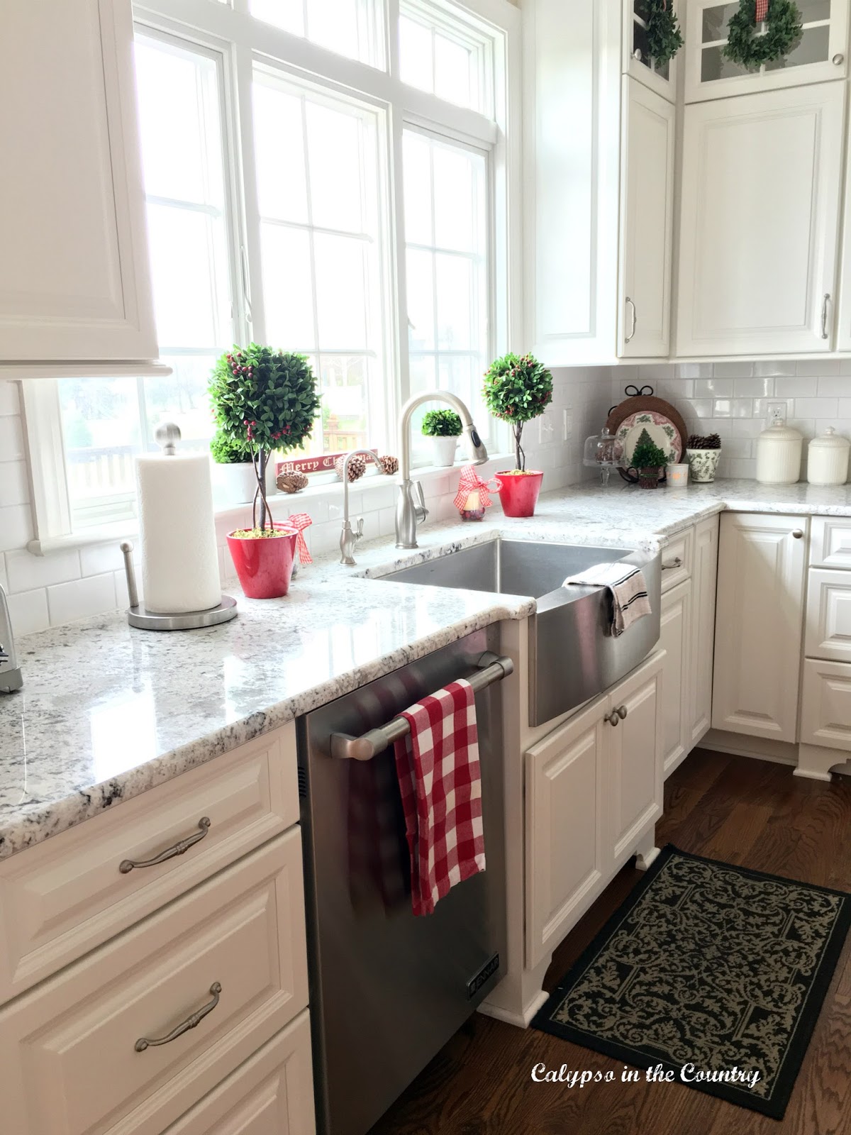 Farm Sink in front of windows White Kitchen with farm sink in front of windows - decorated for Christmas