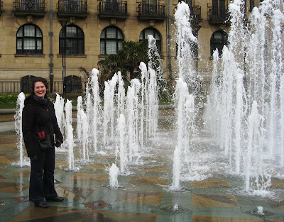 Lola II standing next to a fountain