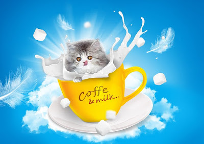 alt="gatito metido en taza de cafe con leche"
