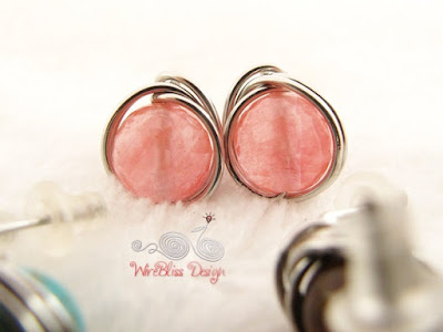 Close up of Cherry Quartz wire wrapped earrings by WireBliss