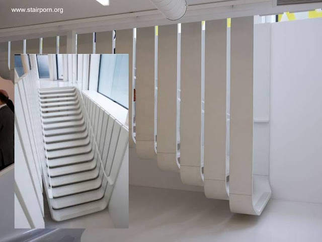 Cada peldaño es parte de una cinta de concreto que cuelga - Arquitectura Zaha Hadid Architects Escalera interior de concreto diseño de Zaha Hadid