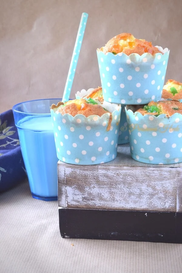 Pineapple cupcakes Muffins stacked on a box and served with milk