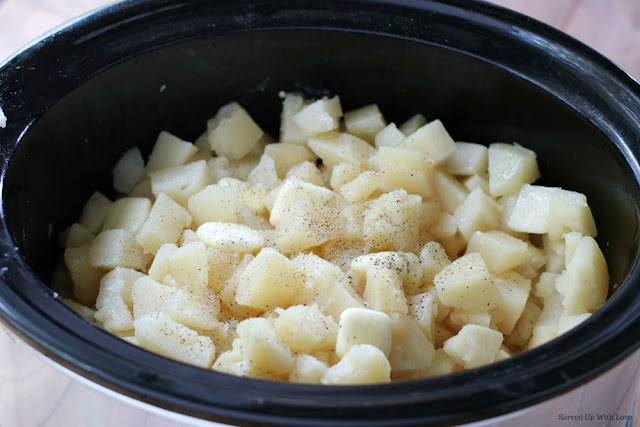 Cubed potatoes in crock pot or slow cooker