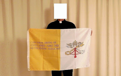Padre Marcelo and his flag with the sentence in Latin.