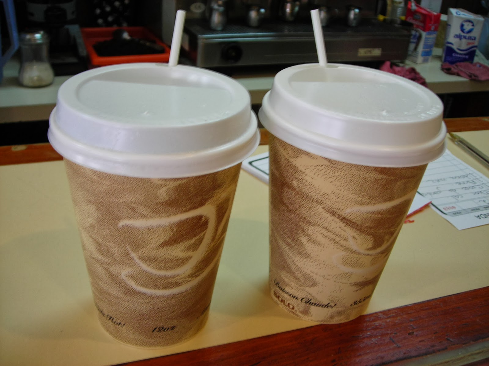 Two takeaway cups of cappuccino coffee - Free Stock Image