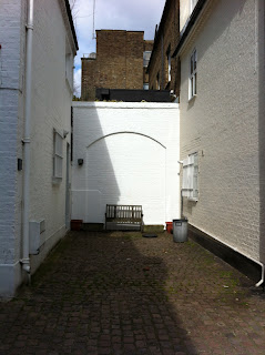  Wooden bench in Fulton Mews, London W2