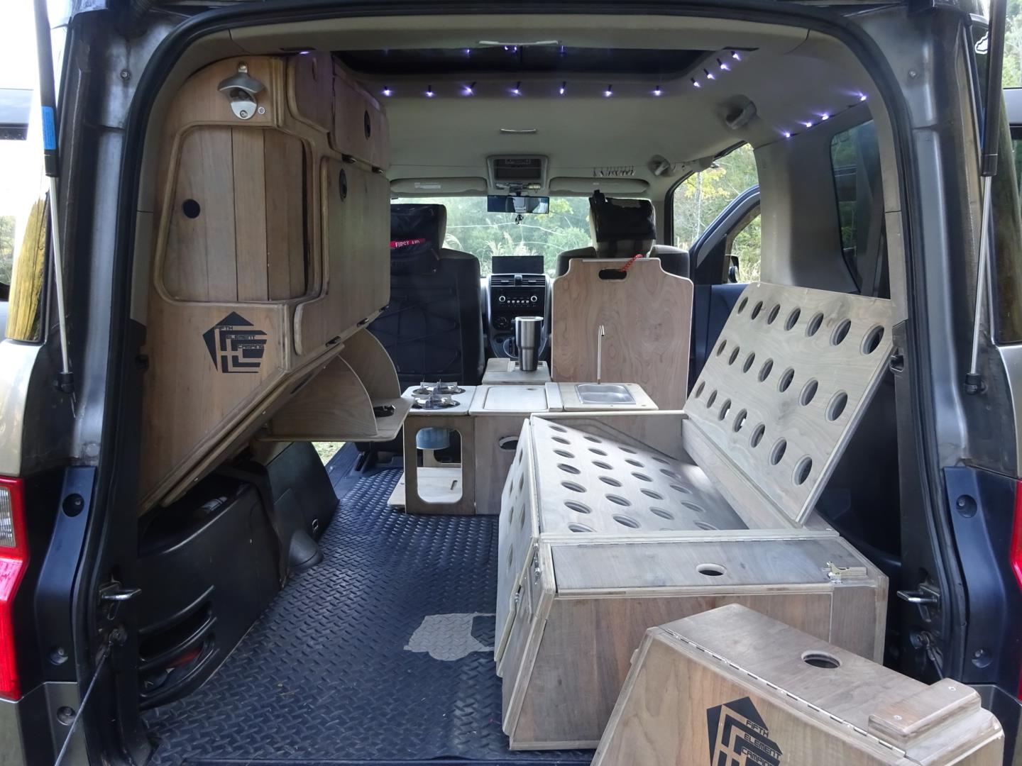 Just A Car Guy Nick made his own camper from his Honda Element (cheaper and more reliable than