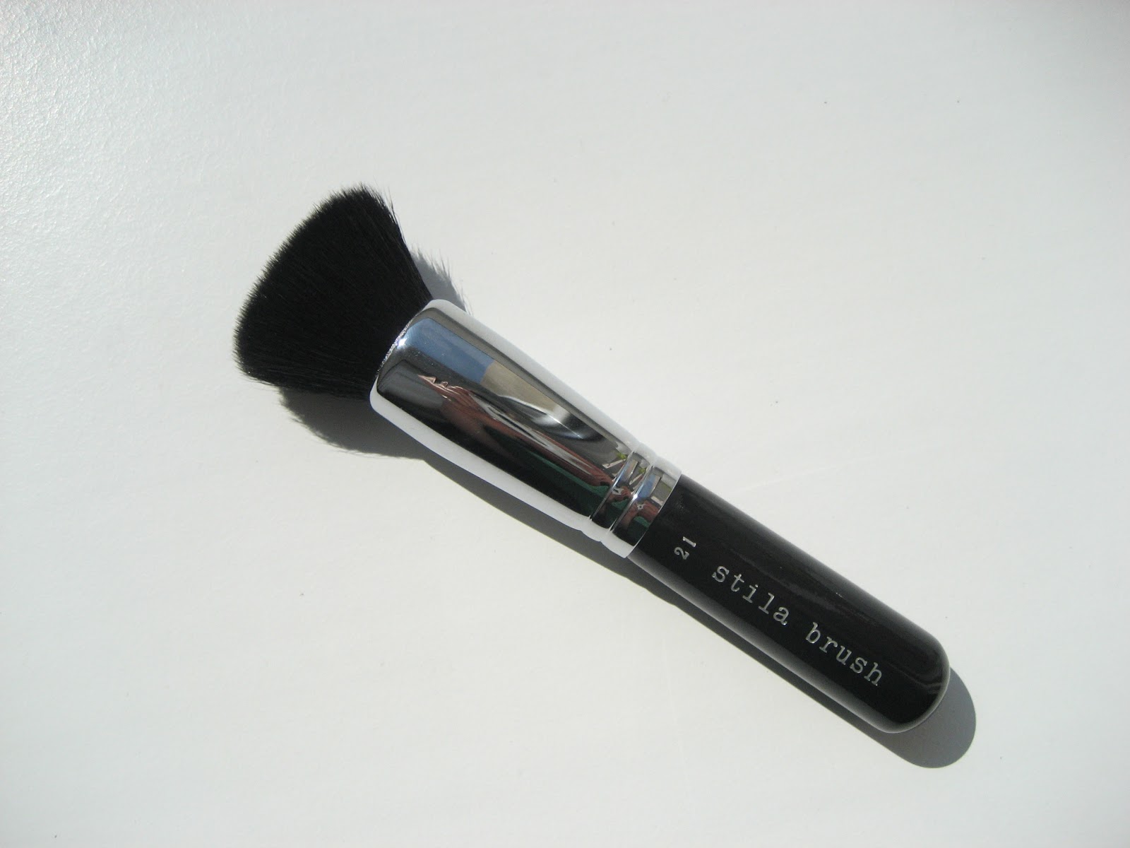 delicate hummingbird. Stila 21 Powder Foundation Brush.