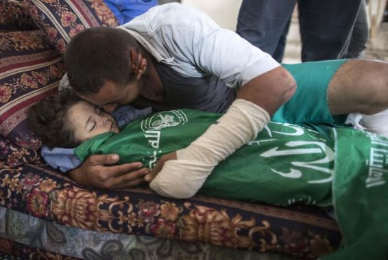 Sad Photos: Father Cradles, Kisses His Dead 3Year Old Killed in Israeli Airstrike (photos)