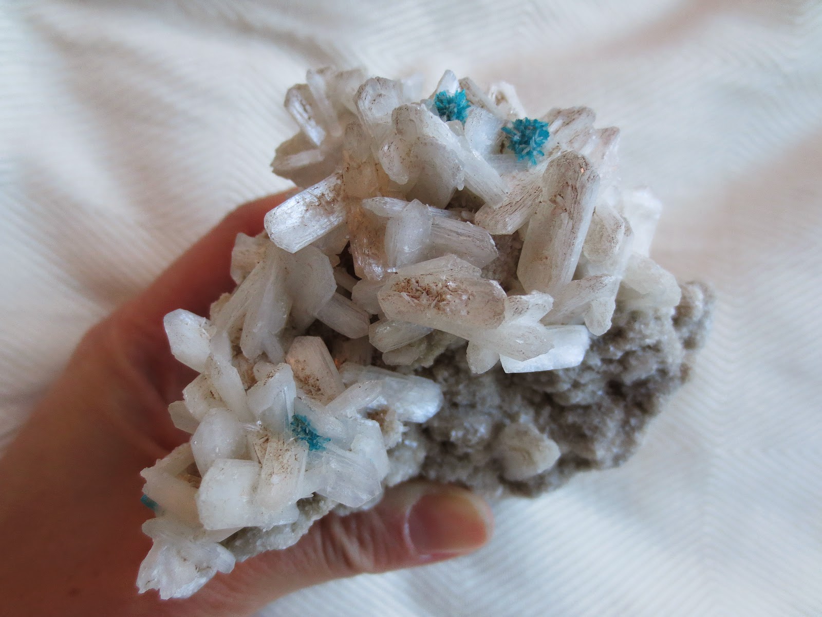 Blue cavansite crystals on stilbite