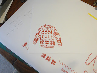 Red and white stamped knitted jumper with Cool Yule sentiment