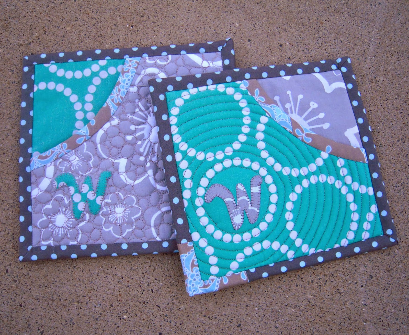 http://sewinsomethin.blogspot.com/2014/02/a-couple-of-quilted-hot-pads-and-some.html