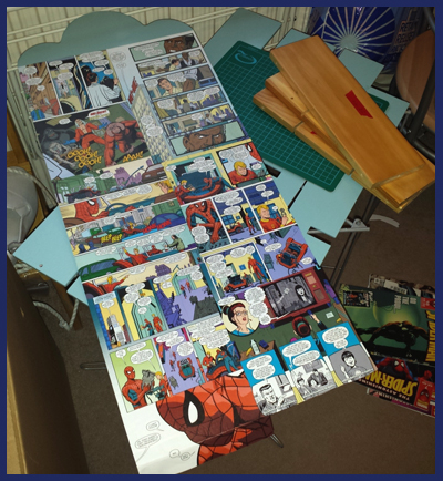After a lot of deliberation, I finally decided on comic book pages for the background.  I used whole pages so the story could be read and actually make sense.  Armed with my Spider-man comics and my faithful Mod Podge, this didn't take too long to do at all, and I have to admit I do feel the effect is rather good!