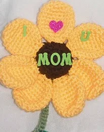 http://www.ravelry.com/patterns/library/free-pattern--mothers-day-magnet-a-crochet-pattern
