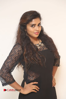 Actress Karunya Stills in Black Long Dress at Dharma Yogi Audio Launch  0017