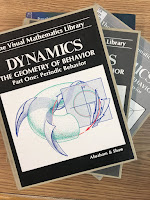 Dynamics: The Geometry of Behavior, by Abraham and Shaw, superimposed on Intermediate Physics for Medicine and Biology.