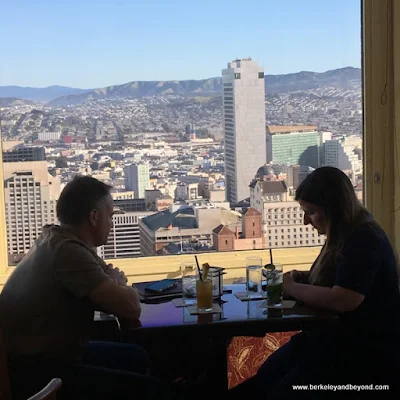 couple enjoying cocktails at the Top of the Mark in San Francisco, California