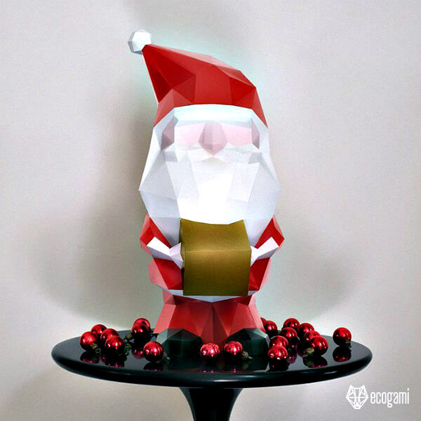 Printable, foldable 3D paper Santa decoration standing on table