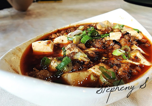 Famous SiChuan China Mapo Beancurd cooked in spicy sauce topping with chopped green onion
