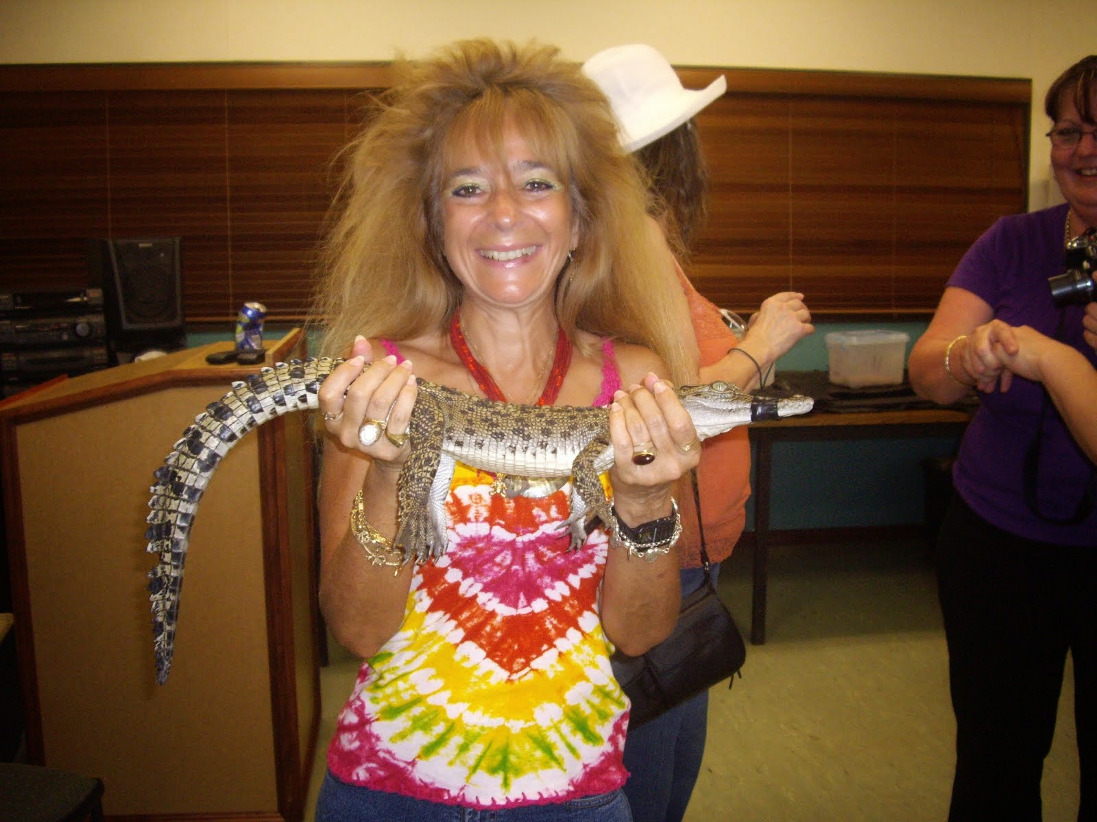 YOUR TOUR GUIDE WRESTLING WITH A BABY CROCODILE IN NEARBY DARWIN, AUSTRALIA IN THE NORTH. TERRITORY